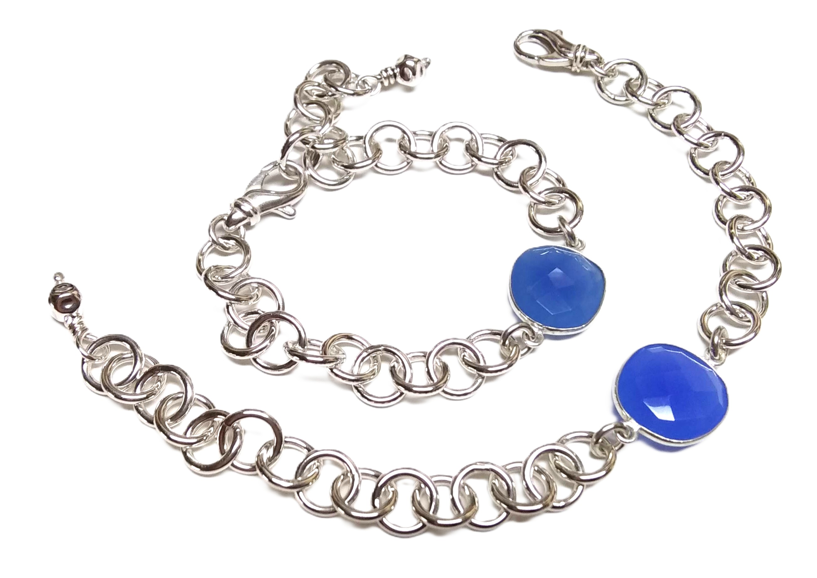 a silver chain with blue stones