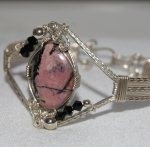 Judy Ellis's Gem Profile- Rhodonite - , General Education, , Rhodonite wrapped in a bracelet