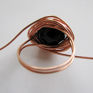 Albina Manning's Quick Wired Bead Ring - , Contemporary Wire Jewelry, Wire Wrapping, Wrapping, Wire Wrapping Jewelry, Ring removed from mandrel with the wrapped wire still on it.