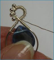 Judy Larson's Beaded Briolette Pendant - , Wire Weaving, Wire Wrapping, Wrapping, Wire Wrapping Jewelry, Weaving, Wire Weaving, Weaving Wire, Continue wrapping around the loops.