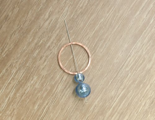 Kylie Jones's Beaded RIng Pendant - , Contemporary Wire Jewelry, Texturing, Butane Torch, Soldering, Solder, put the headpin through the hole in the ring