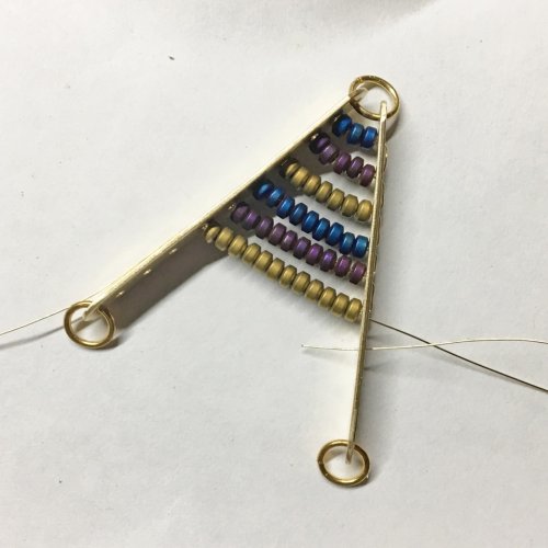 Helen I. Driggs's Beaded Chevron Pendant - , Contemporary Wire Jewelry, Filing, Finishing, How To Punch Holes, Hole Punching, Punch A Hole, Drilling, Drill, Adding Beads to Pattern wire