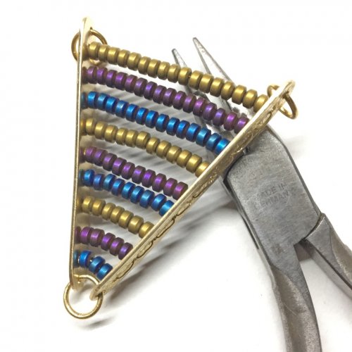 Helen I. Driggs's Beaded Chevron Pendant - , Contemporary Wire Jewelry, Filing, Finishing, How To Punch Holes, Hole Punching, Punch A Hole, Drilling, Drill, Finishing beading on Pattern wire