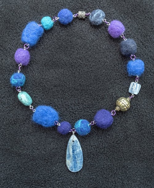 Nancy Chase's French Blues Necklace, Contemporary Wire Jewelry. Loops, Wire Loop, Wrapped Wire Loop. The wool beads along with the various gemstone, and brass are assorted sizes of lightweight beads each measuring 1/2 inch to 1 inch in length.