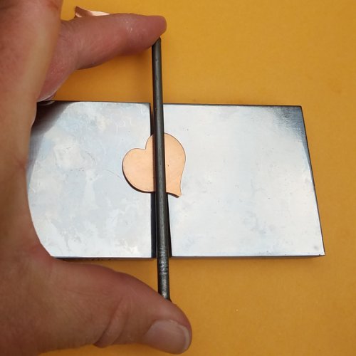 Debbie Blair's Adding Creases to a Metal Blank - , Metalwork, Tools, using a nail to add a crease in metal