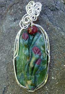 A Fuchsite Cabochon wrapped with Argentium Silver Wire by Becky Davis.