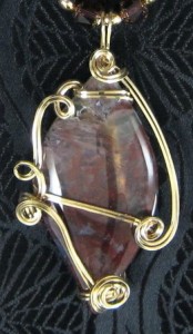 Frances Lediaev wire wrapped this beautiful moss agate cabochon.