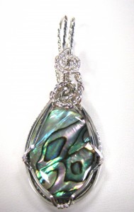 Barbara Rymarquis wire wrapped this abalone shell in sterling silver. This pendant is reversible!