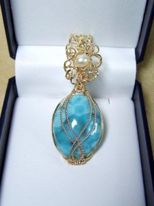 Judy Copeland wrapped this larimar pendant in gold-filled wire with a focal freshwater pearl surrounded in twisted gold-filled filigree.